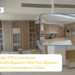A split-view image showing a modern kitchen and living area under construction, highlighting the handover process handled by top renovation companies in Dubai.