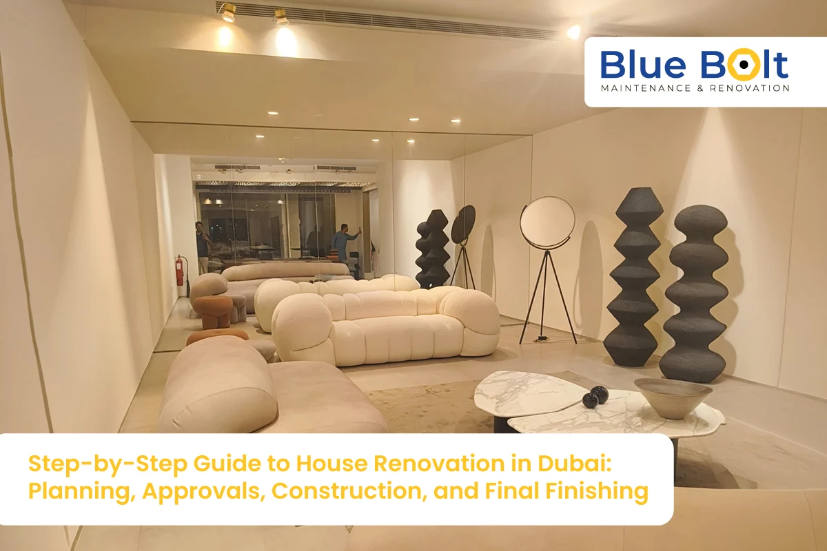 A modern, minimalist living room interior featuring curved white furniture and avant-garde decor, showcasing a professional house renovation in Dubai by Blue Bolt Maintenance.