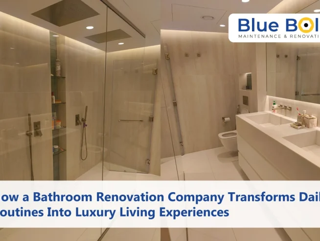 A modern, bathroom designed by a Bathroom renovation company, featuring a dual-sink vanity, glass-enclosed walk-in shower with rainfall heads, and warm ambient lighting.