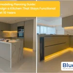 A side-by-side comparison of a modern Kitchen Remodeling project featuring sleek olive-grey cabinetry, marble-patterned countertops and backsplashes, and warm LED under-cabinet lighting.