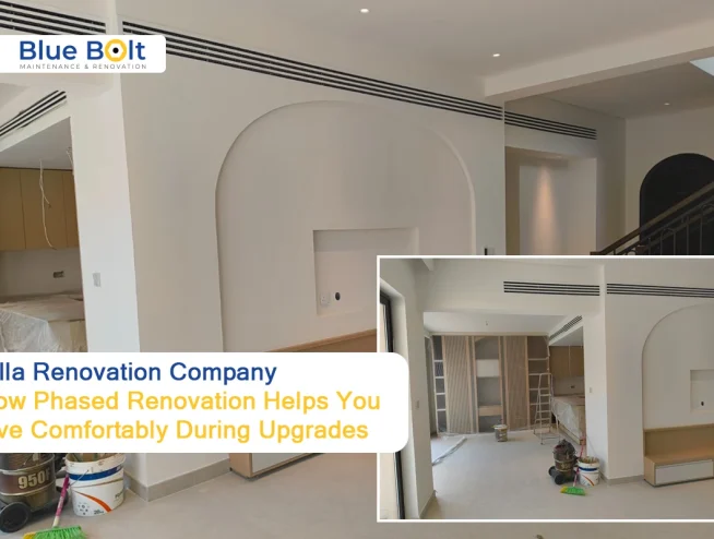 Villa Renovation Company: How Phased Renovation Helps You Live Comfortably During Upgrades An interior view of a home undergoing a phased project by a Villa Renovation Company, showcasing newly painted white walls with arched architectural details, recessed lighting, and professional construction equipment.