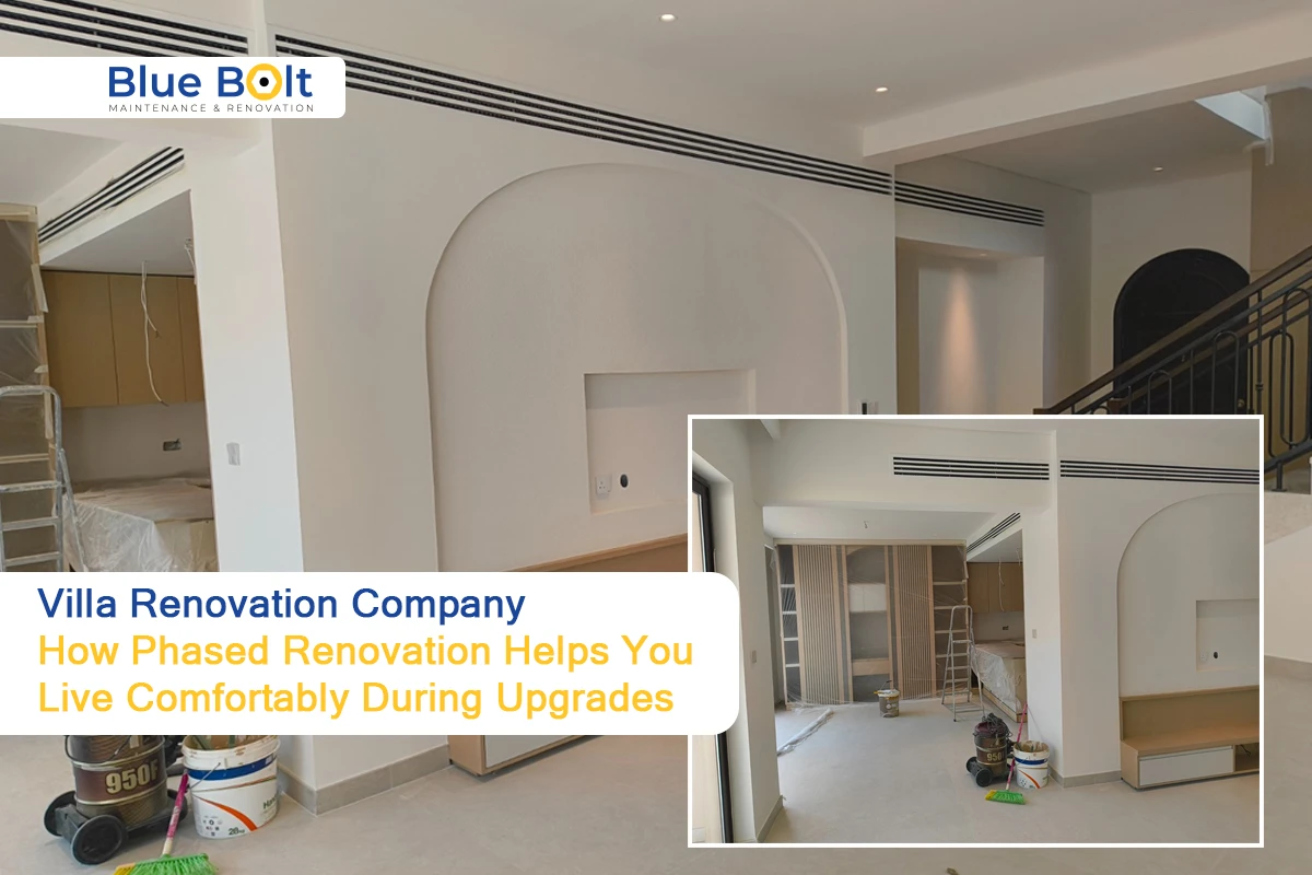 An interior view of a home undergoing a phased project by a Villa Renovation Company, showcasing newly painted white walls with arched architectural details, recessed lighting, and professional construction equipment.