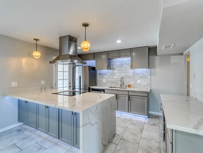 10 Kitchen Remodel Features That Help to Keep Kitchens Organized Year-Round Kitchen remodel featuring smart storage solutions for an organized cooking space