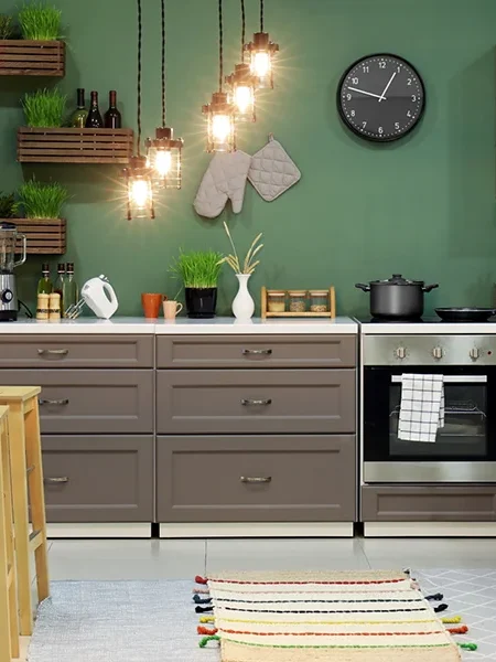 Modern kitchen with coordinated wall colours and layered lighting for kitchen renovation services